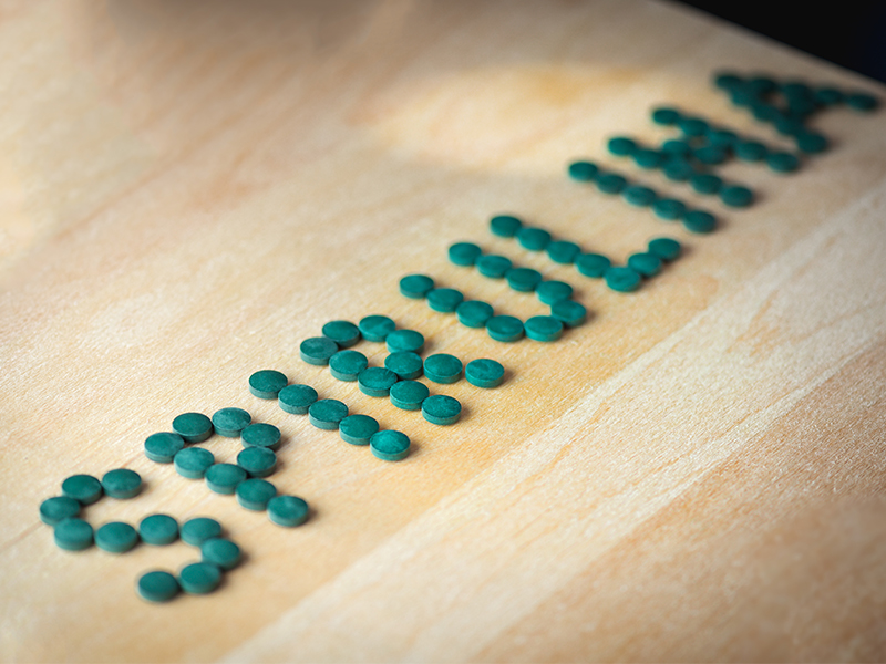 spirulina tablets on desk